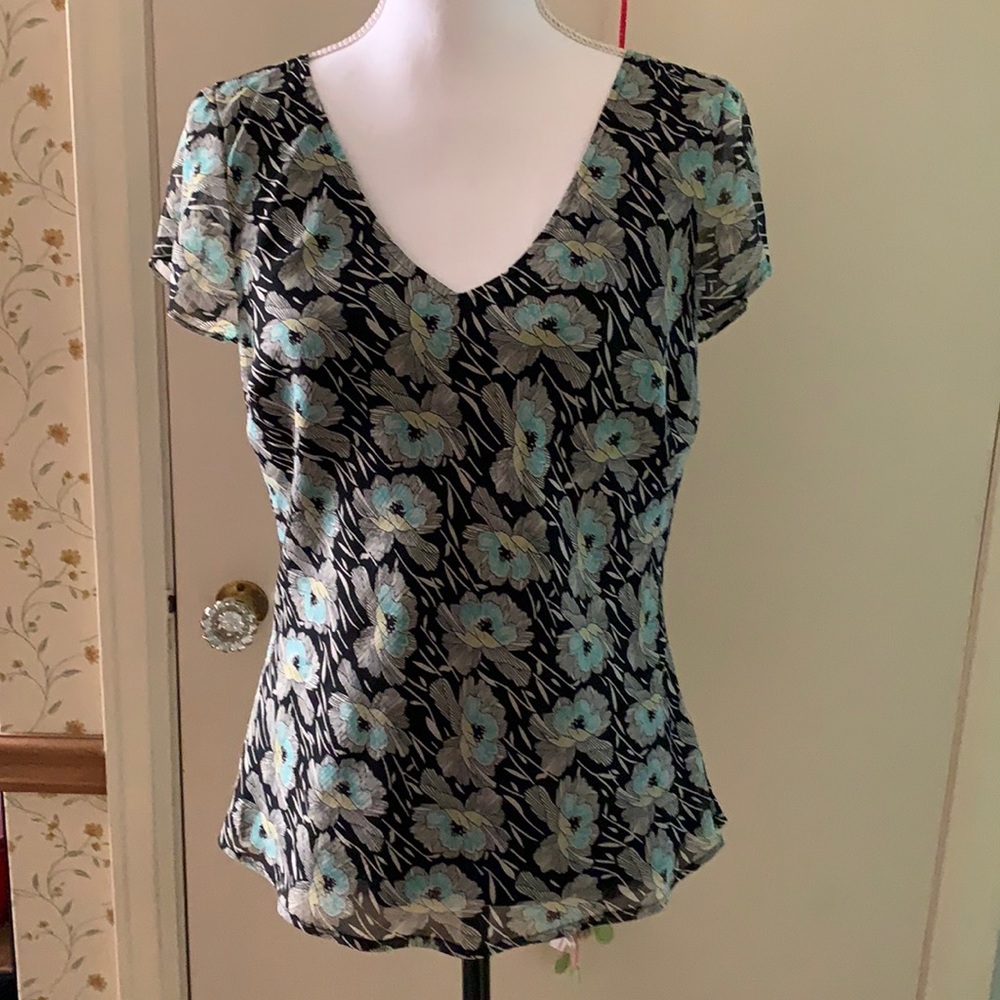 Villager size small V-neck top.  Black floral